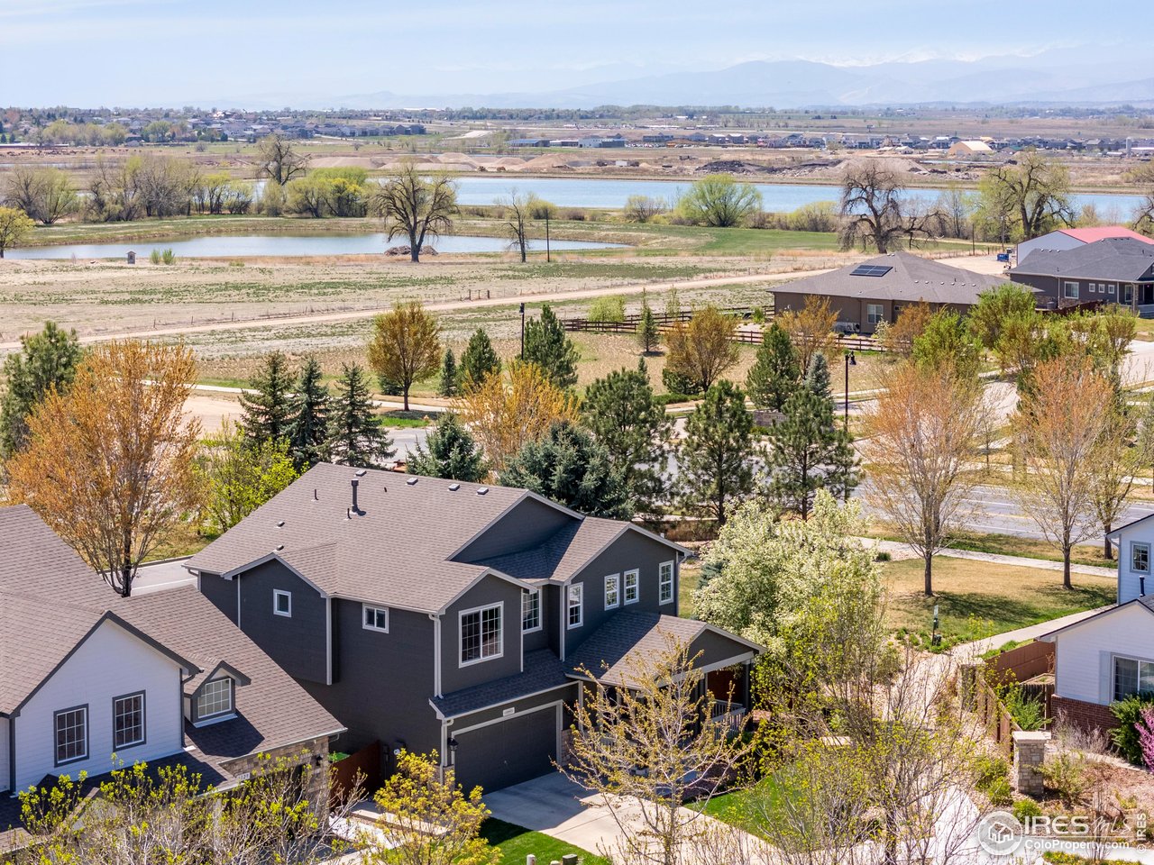 6117 Gold Dust Road Timnath, CO 80547 - Photo 2 of 43 a view of a lake with a mountain