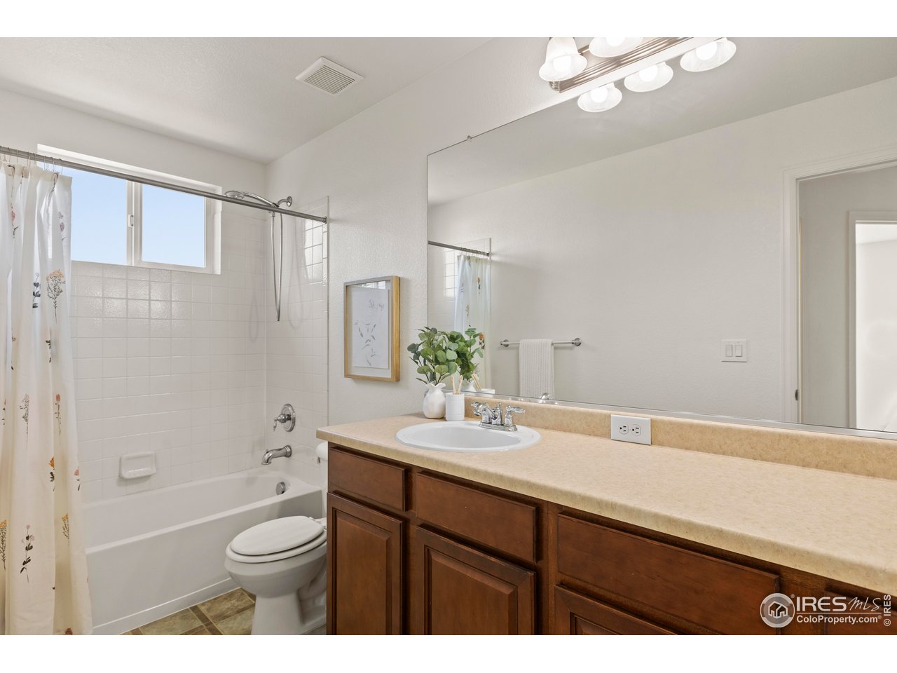6117 Gold Dust Road Timnath, CO 80547 - Photo 23 of 43 a bathroom with a sink a toilet and shower