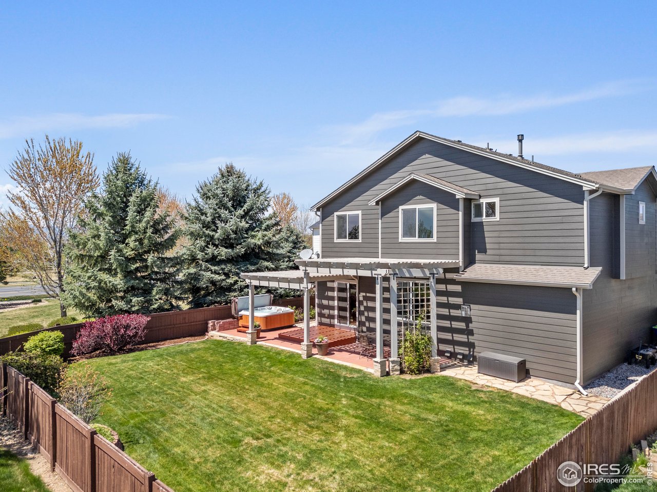 6117 Gold Dust Road Timnath, CO 80547 - Photo 29 of 43 a view of a house with a yard and sitting area