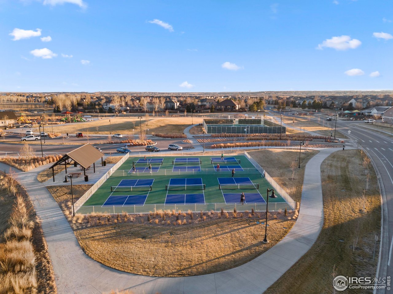 6117 Gold Dust Road Timnath, CO 80547 - Photo 41 of 43 a view of a swimming pool with outdoor seating