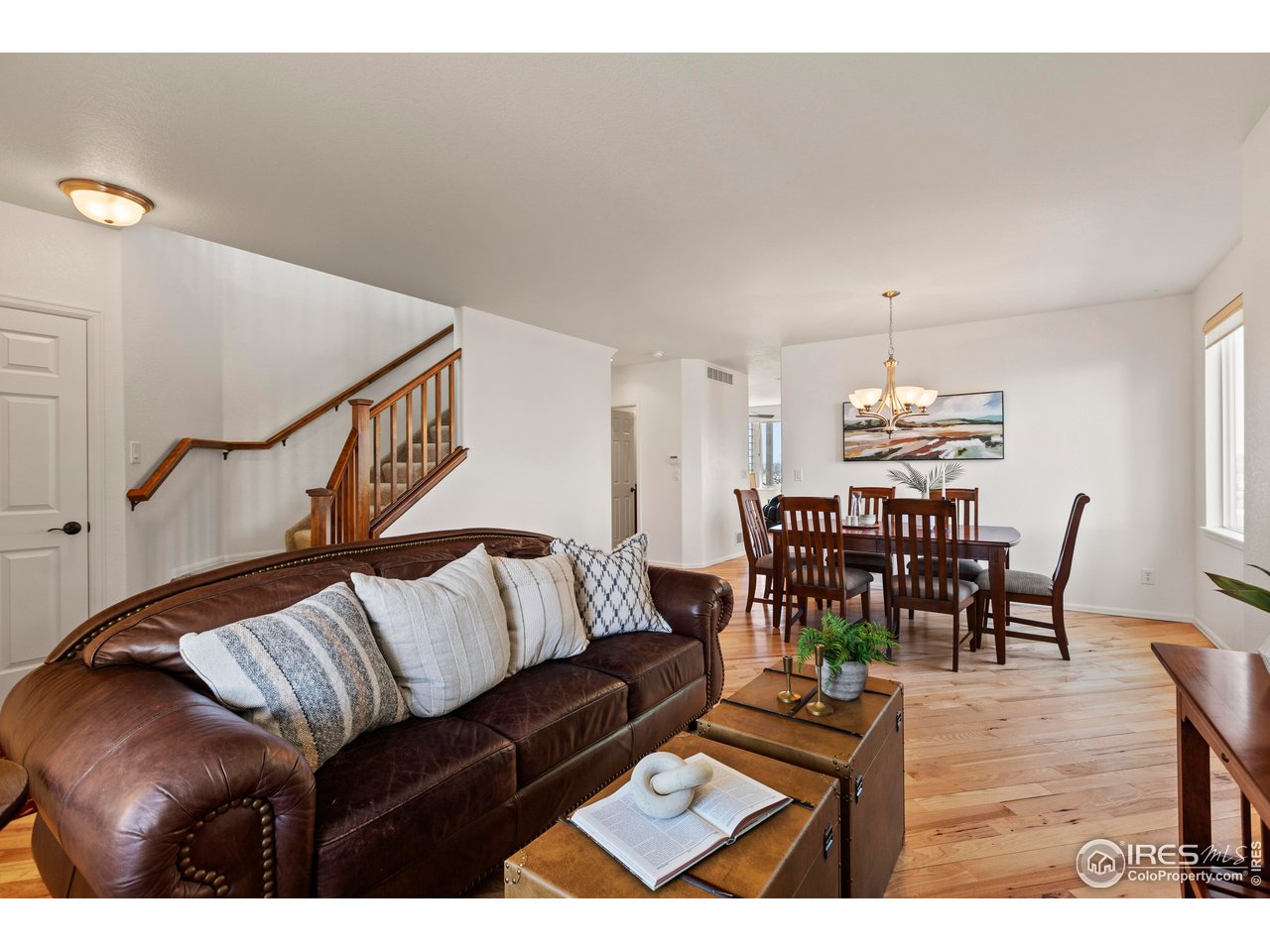 6117 Gold Dust Road Timnath, CO 80547 - Photo 6 of 43 a living room with furniture and wooden floor