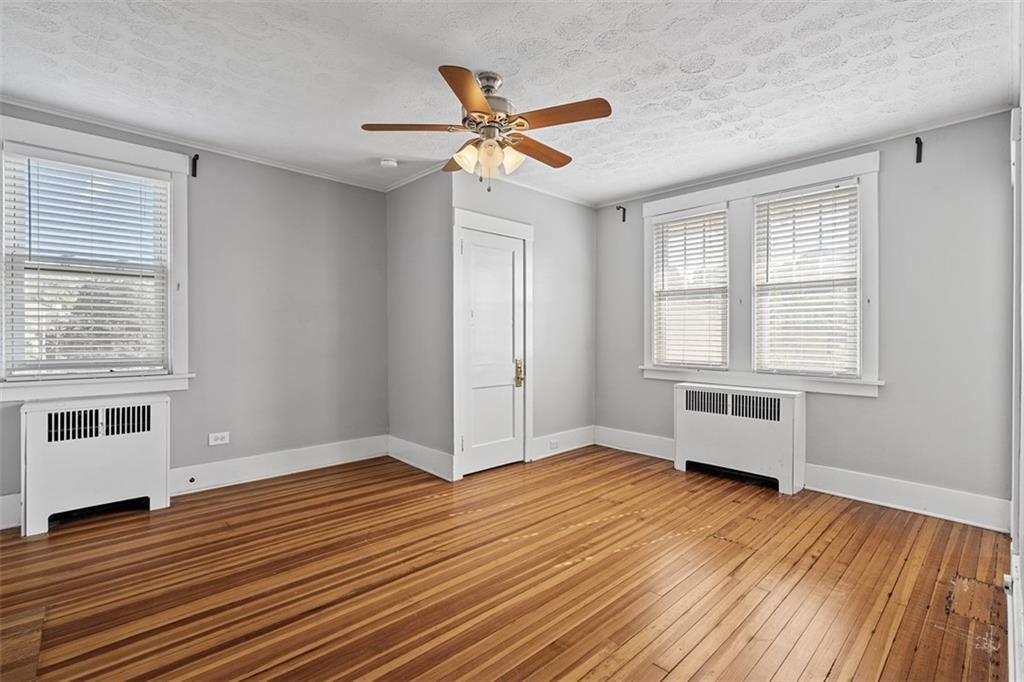3565 Gerber Avenue Pittsburgh, PA 15212 - Photo 13 of 28 a view of an empty room with wooden floor and a window
