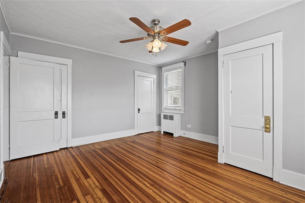 3565 Gerber Avenue Pittsburgh, PA 15212 - Photo 14 of 28 a view of a livingroom with wooden floor and a ceiling fan