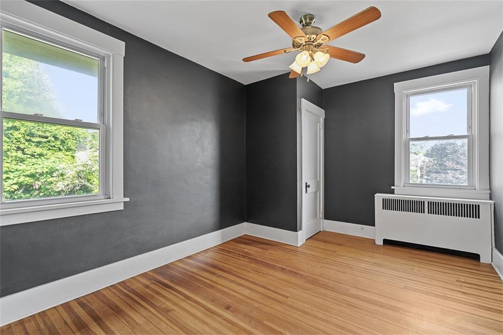 3565 Gerber Avenue Pittsburgh, PA 15212 - Photo 16 of 28 a view of an empty room with a window and wooden floor