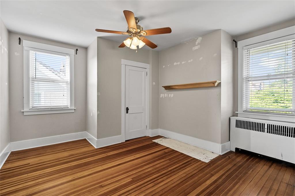 3565 Gerber Avenue Pittsburgh, PA 15212 - Photo 17 of 28 a view of an empty room with wooden floor and a window