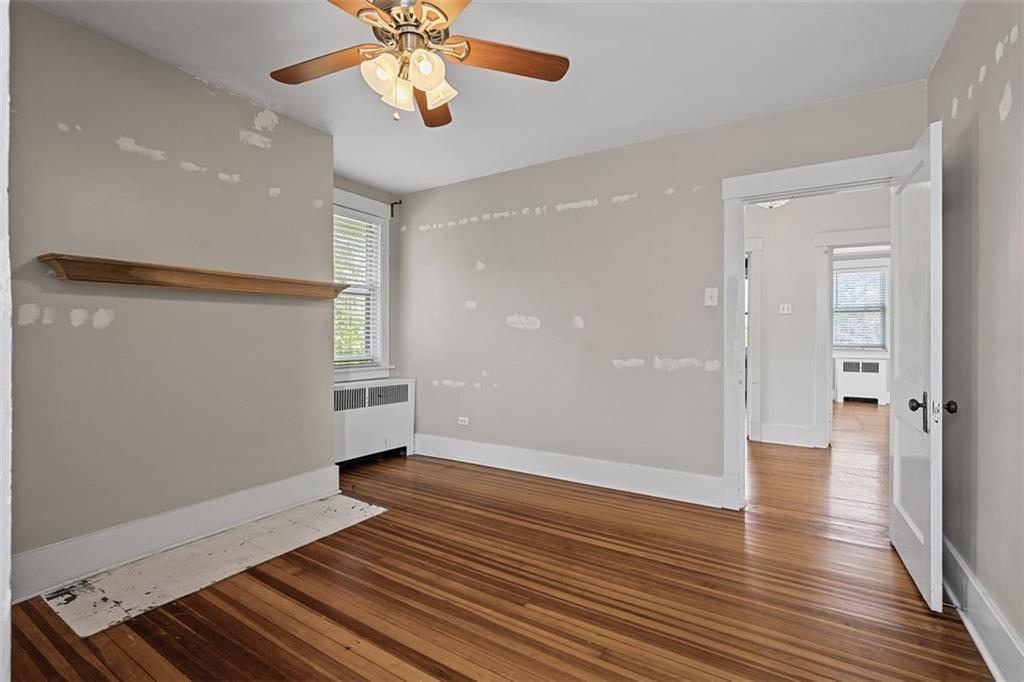 3565 Gerber Avenue Pittsburgh, PA 15212 - Photo 18 of 28 wooden floor in an empty room with a window