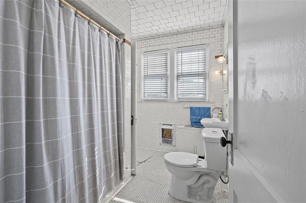 3565 Gerber Avenue Pittsburgh, PA 15212 - Photo 20 of 28 a bathroom with a toilet and a shower