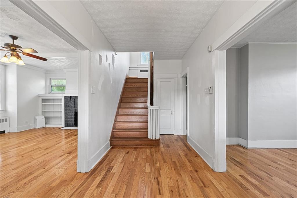 3565 Gerber Avenue Pittsburgh, PA 15212 - Photo 2 of 28 a view of a hallway with wooden floor and staircase