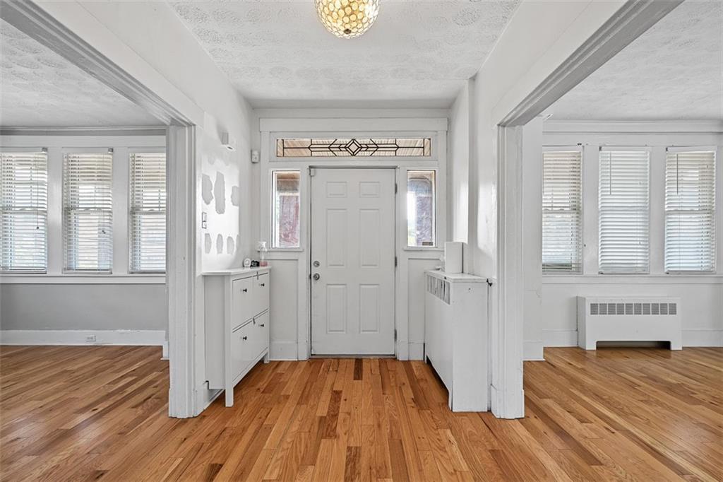 3565 Gerber Avenue Pittsburgh, PA 15212 - Photo 3 of 28 a view of a bedroom with wooden floor and windows