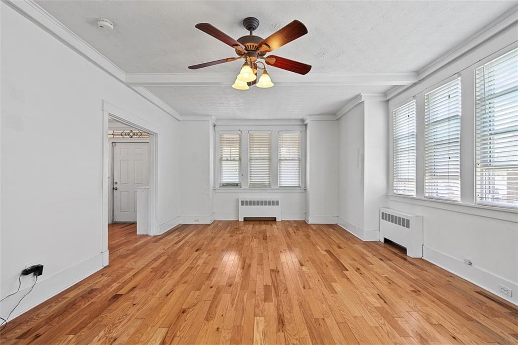 3565 Gerber Avenue Pittsburgh, PA 15212 - Photo 6 of 28 a view of empty room with wooden floor and fan