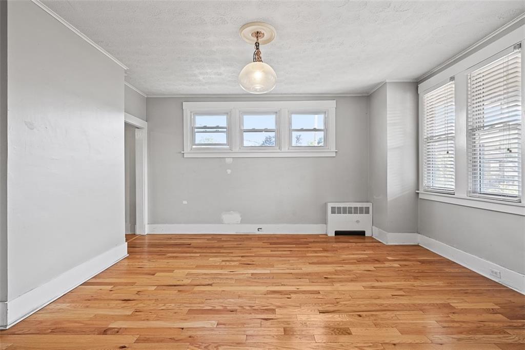 3565 Gerber Avenue Pittsburgh, PA 15212 - Photo 7 of 28 a view of empty room with wooden floor and fan