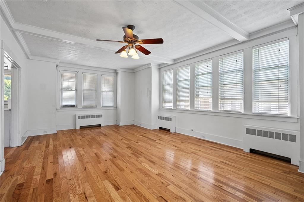 3565 Gerber Avenue Pittsburgh, PA 15212 - Photo 8 of 28 a view of an empty room with a window and wooden floor