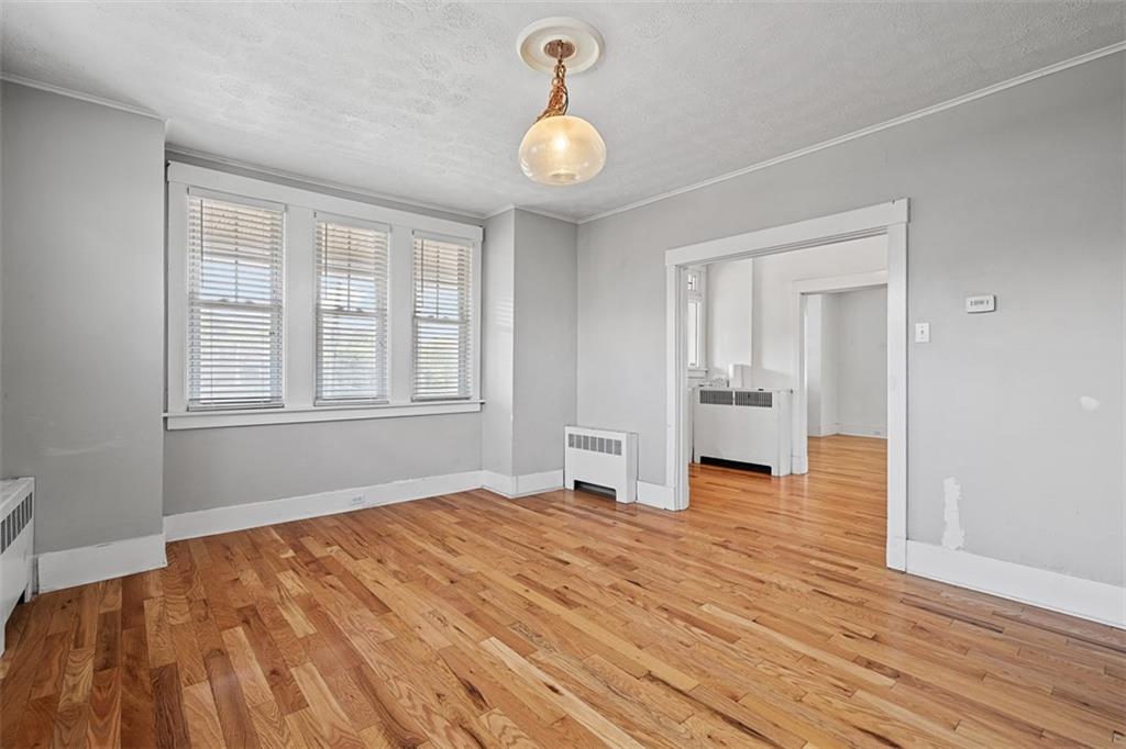 3565 Gerber Avenue Pittsburgh, PA 15212 - Photo 9 of 28 a view of empty room with wooden floor and windows