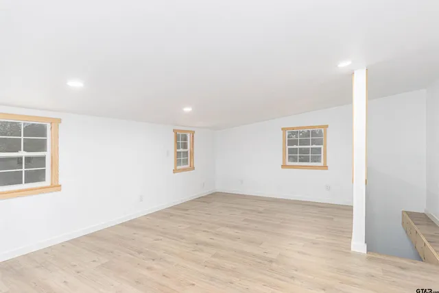 an empty room with windows