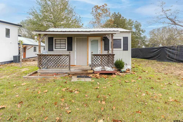 a front view of a house with yard