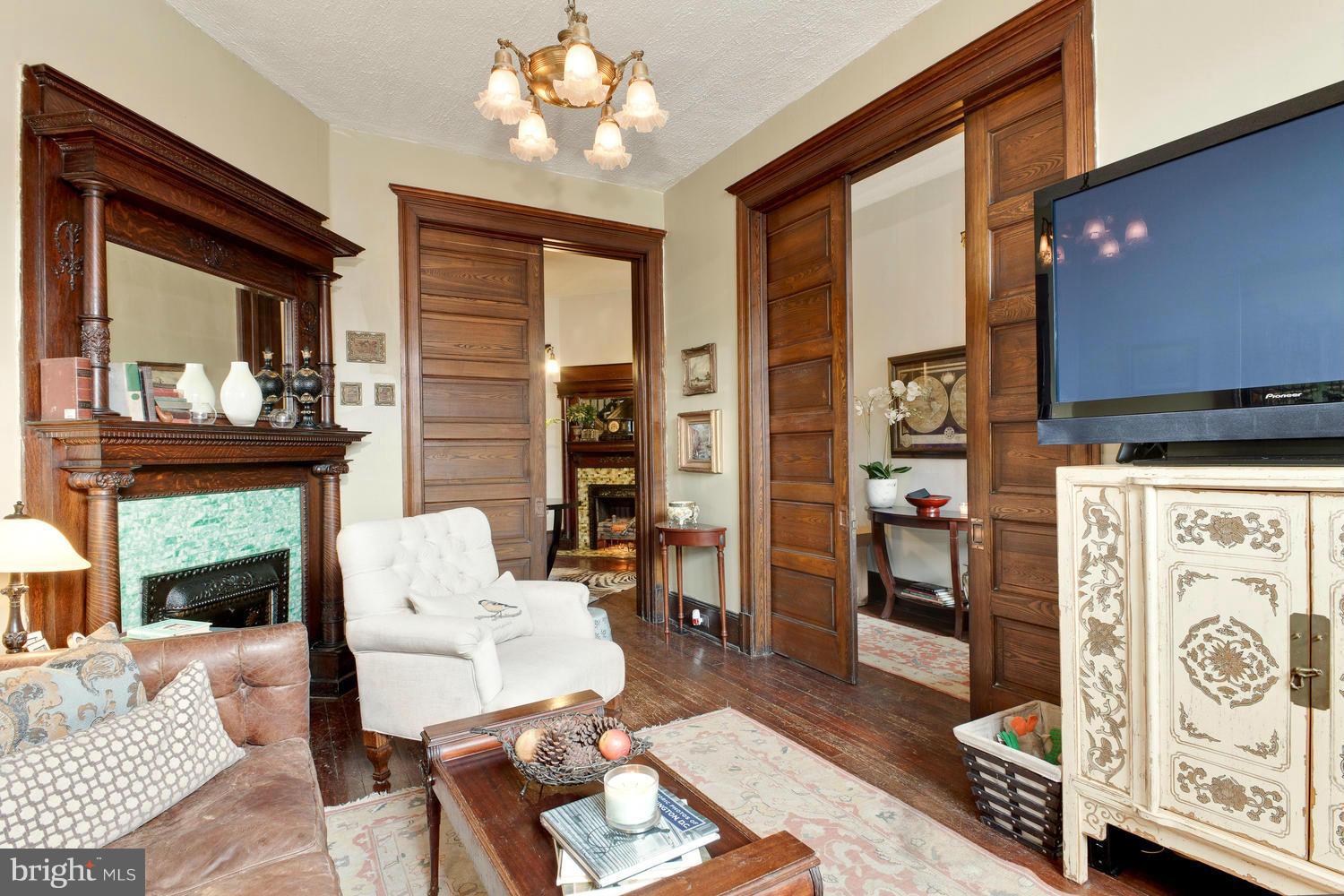 32 R Street Northeast Washington, DC 20002 - Photo 3 of 18 a living room with furniture a chandelier and a fireplace