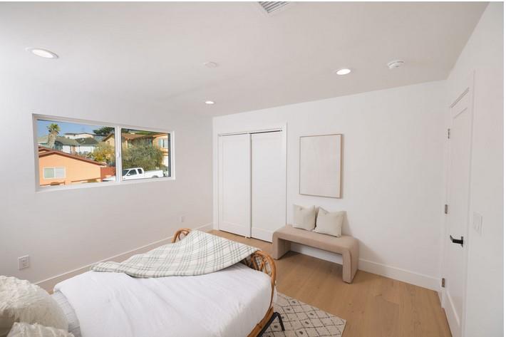 1495 Ancon Street Seaside, CA 93955 - Photo 11 of 35 a bedroom with a bed and a chair