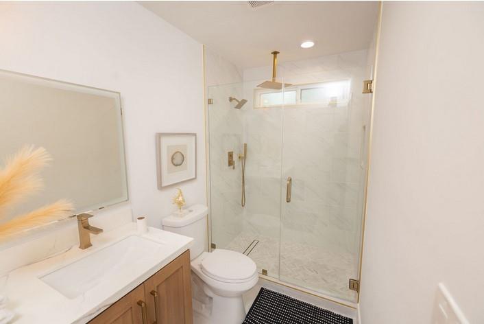 1495 Ancon Street Seaside, CA 93955 - Photo 17 of 35 a bathroom with a sink toilet a mirror and shower