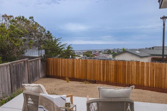 1495 Ancon Street Seaside, CA 93955 - Photo 30 of 35 a backyard of a house with table and chairs