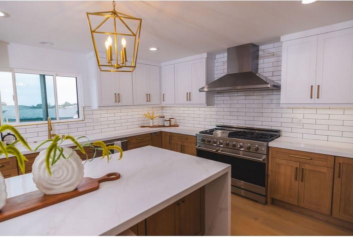 1495 Ancon Street Seaside, CA 93955 - Photo 5 of 35 a kitchen with a stove a sink and a table