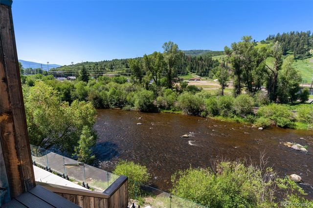 an aerial view of a house with mountain view