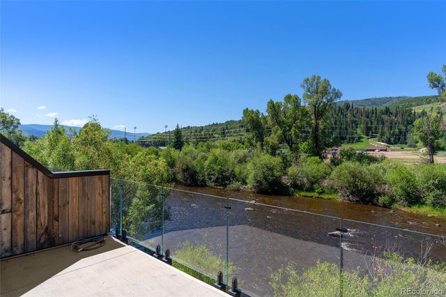 a view of a street with a bench in front of it
