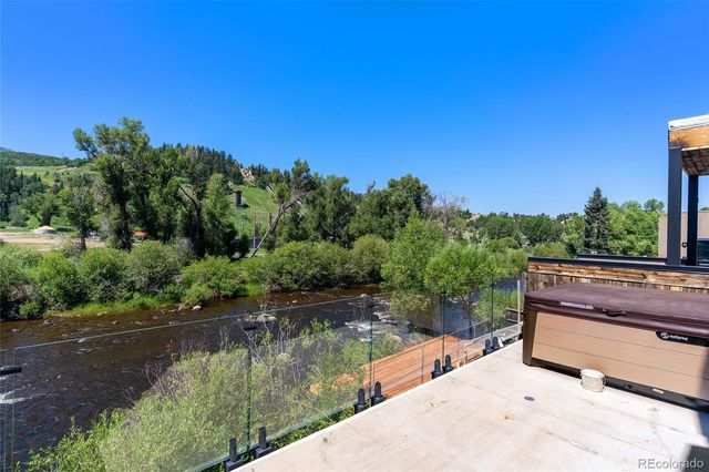 a view of lake with a yard