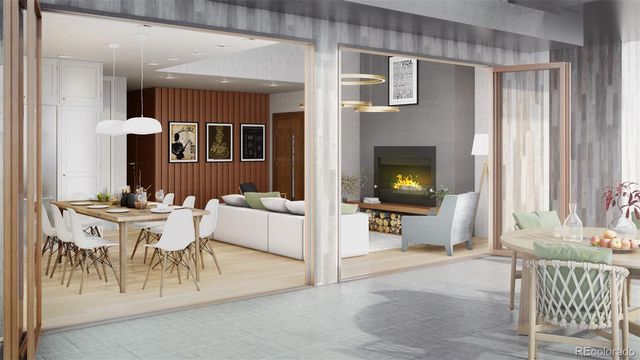 a living room with furniture a dining table and a fireplace