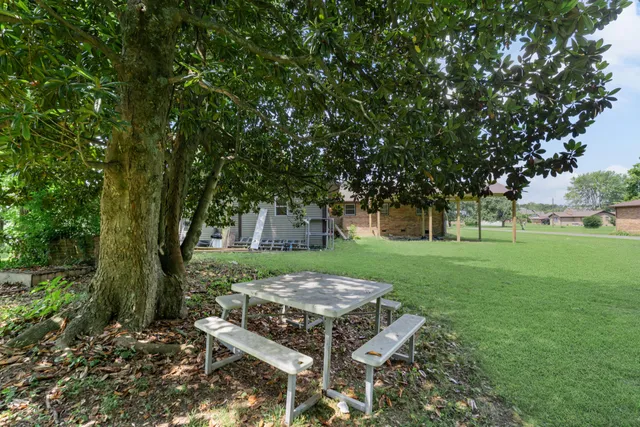 a view of a car park in front of house