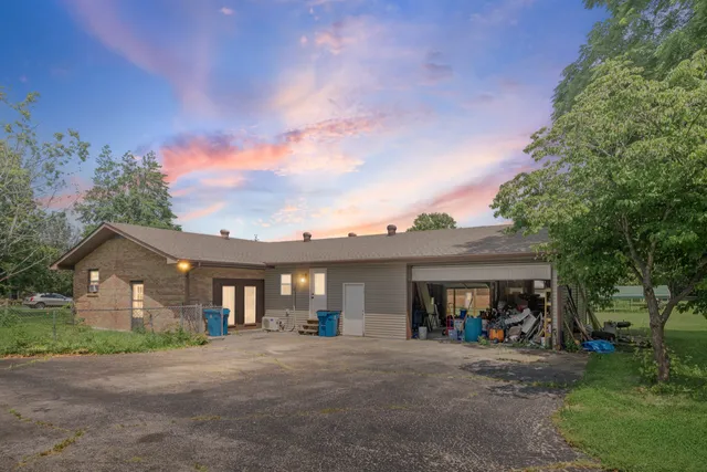 an aerial view of house with yard swimming pool and outdoor seating