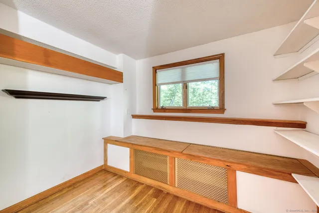 a view of a kitchen with wooden floor and cabinet