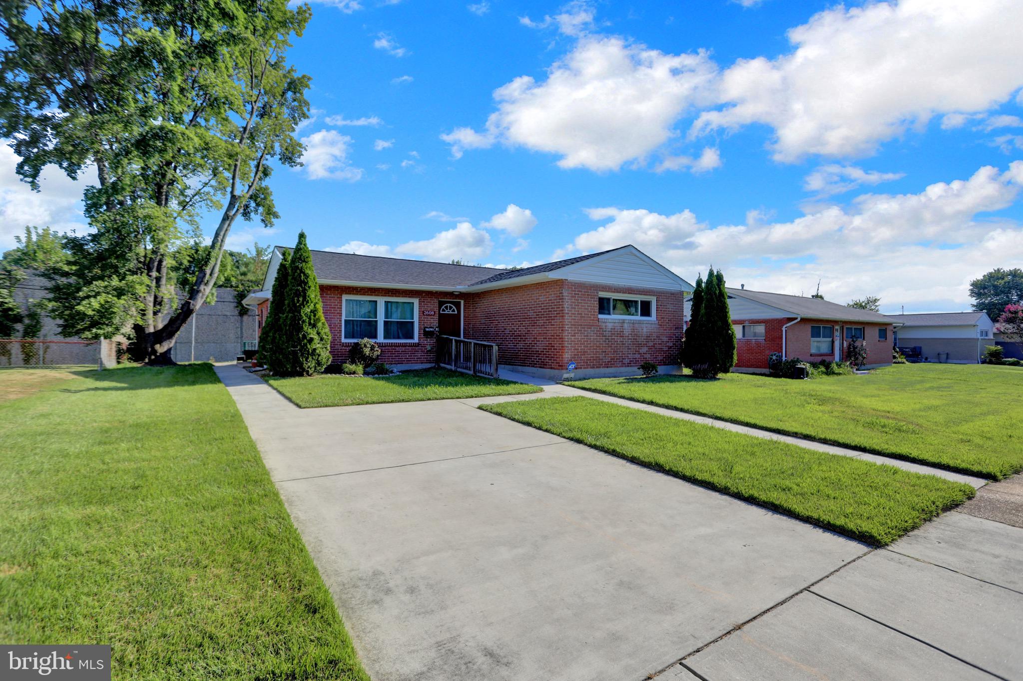 2608 Burridge Road Parkville, MD 21234 - Photo 1 of 15 a front view of house with yard and green space