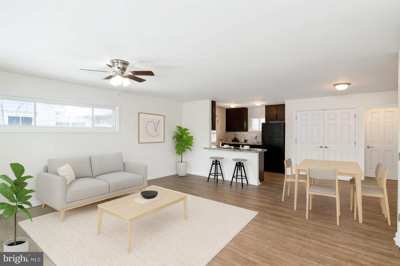 2608 Burridge Road Parkville, MD 21234 - Photo 2 of 15 a living room with furniture and a wooden floor