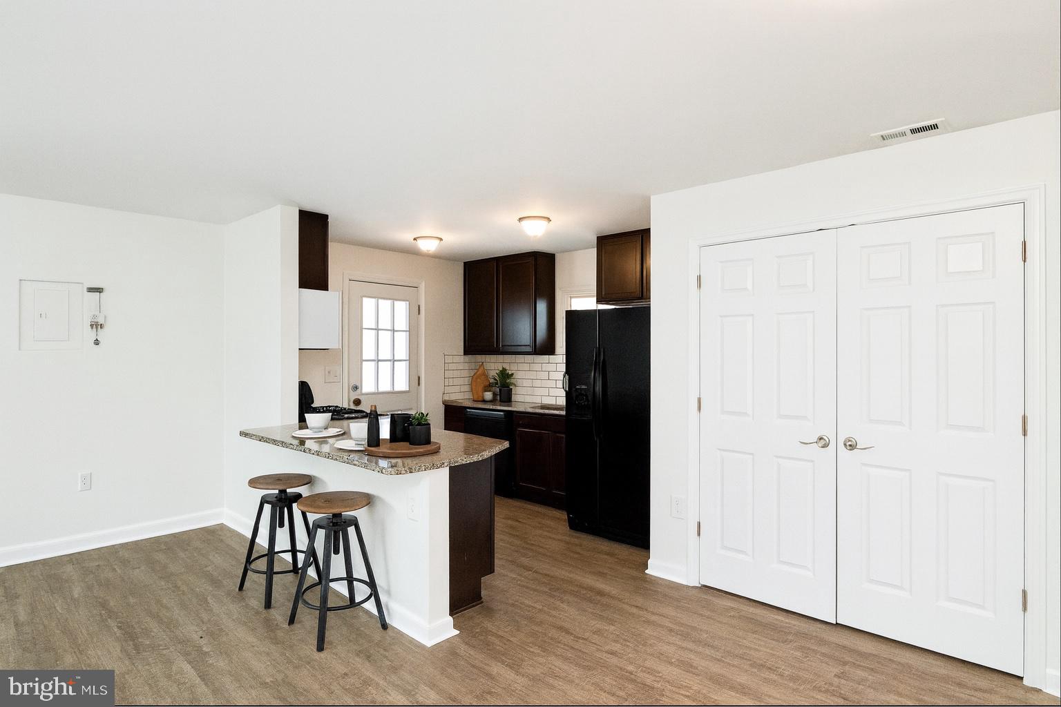 2608 Burridge Road Parkville, MD 21234 - Photo 3 of 15 a kitchen with a sink cabinets and refrigerator