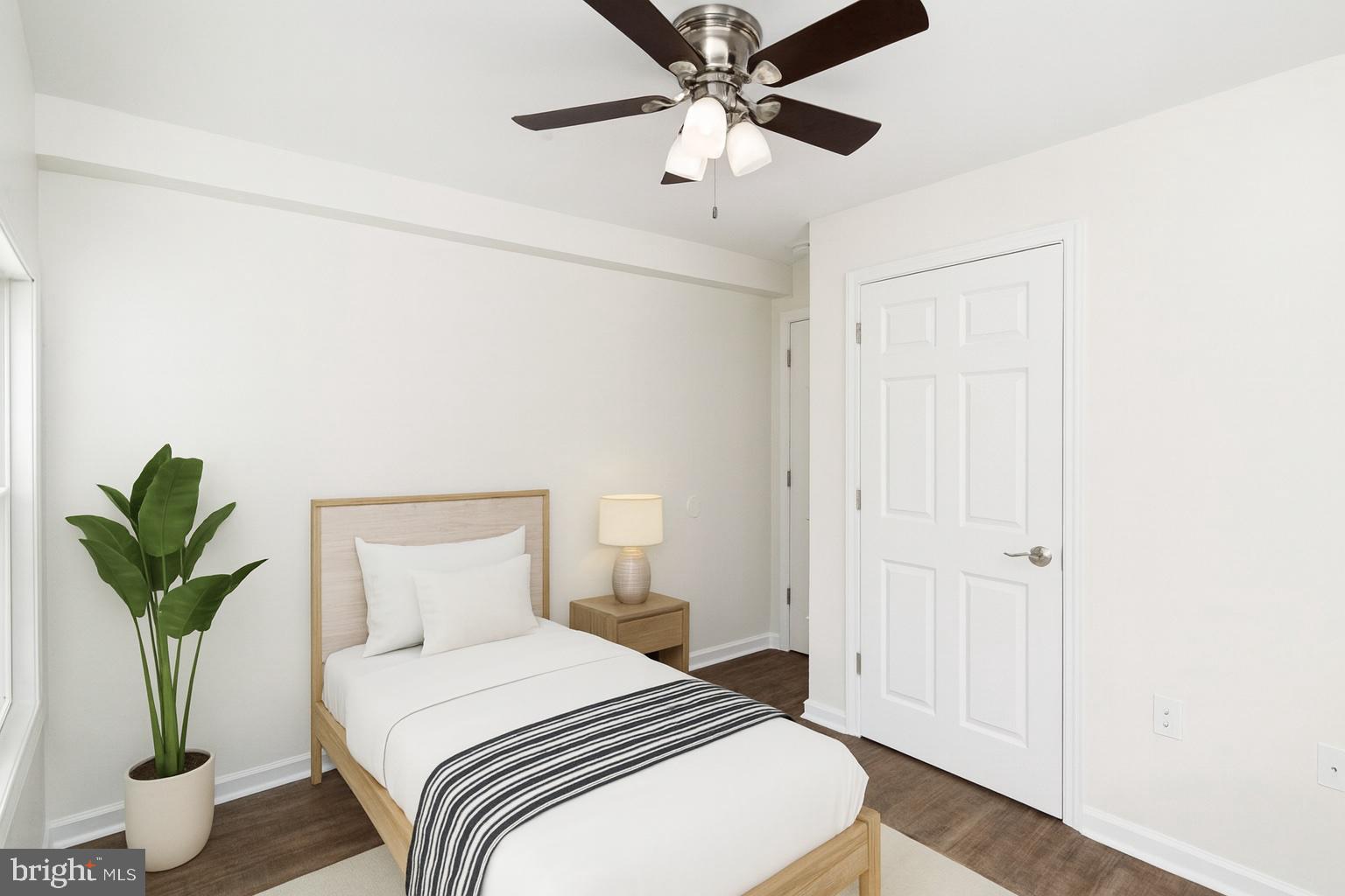 2608 Burridge Road Parkville, MD 21234 - Photo 6 of 15 a bedroom with a bed and a potted plant