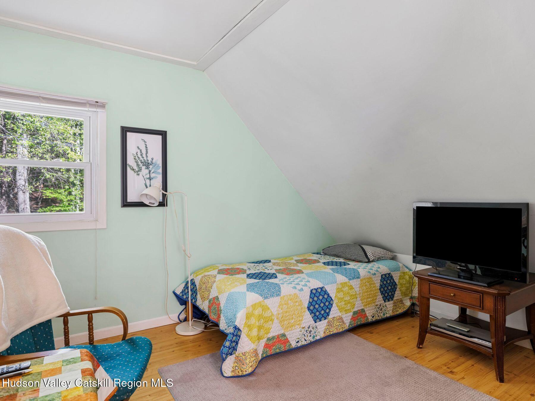 32 Ridge Road Shokan, NY 12481 - Photo 25 of 32 a bedroom with a bed and flat screen tv