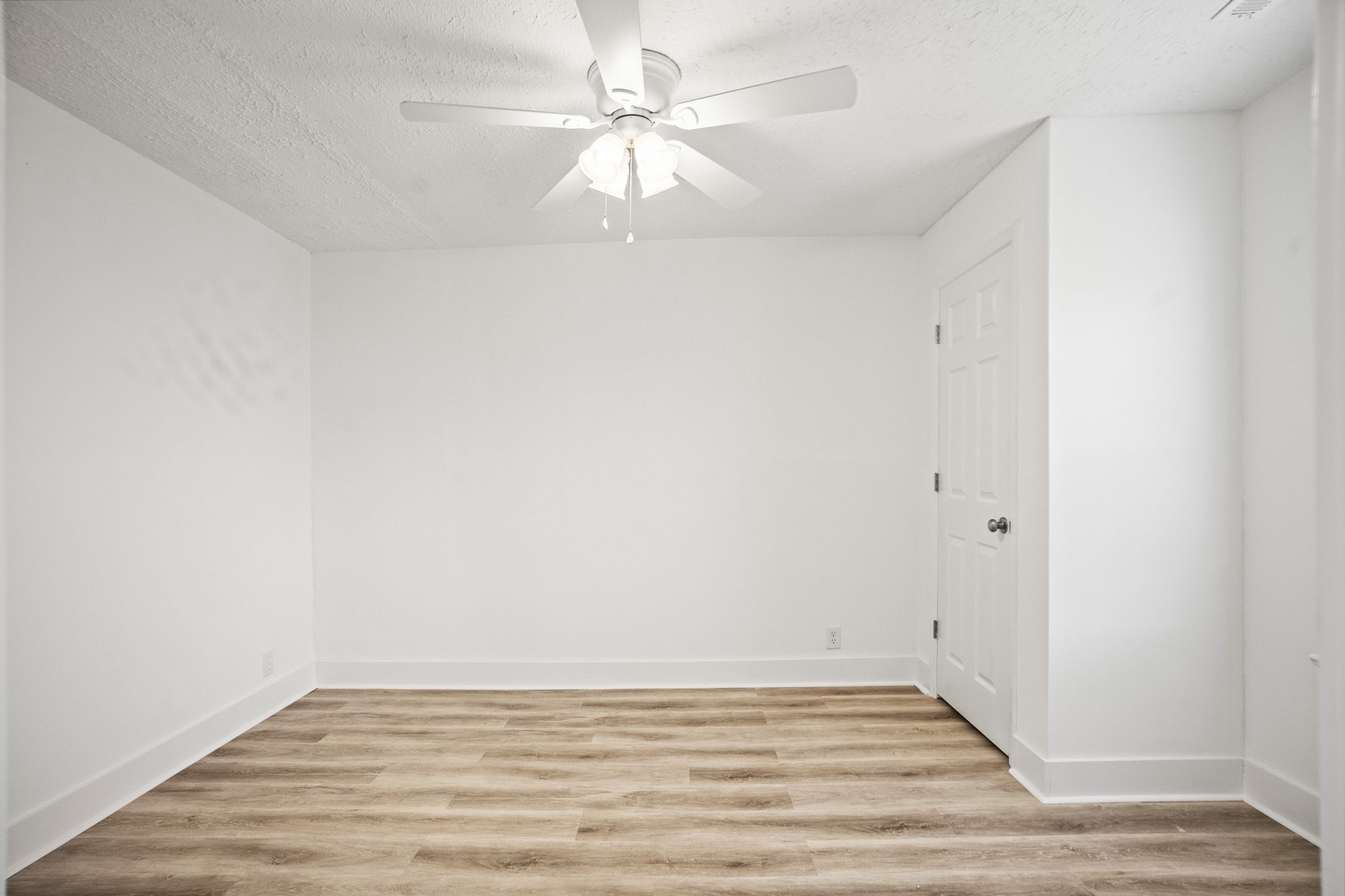 7230 Highway 49 E Springfield Tn 37172 East Springfield, TN 37172 - Photo 20 of 33 a view of an empty room with wooden floor