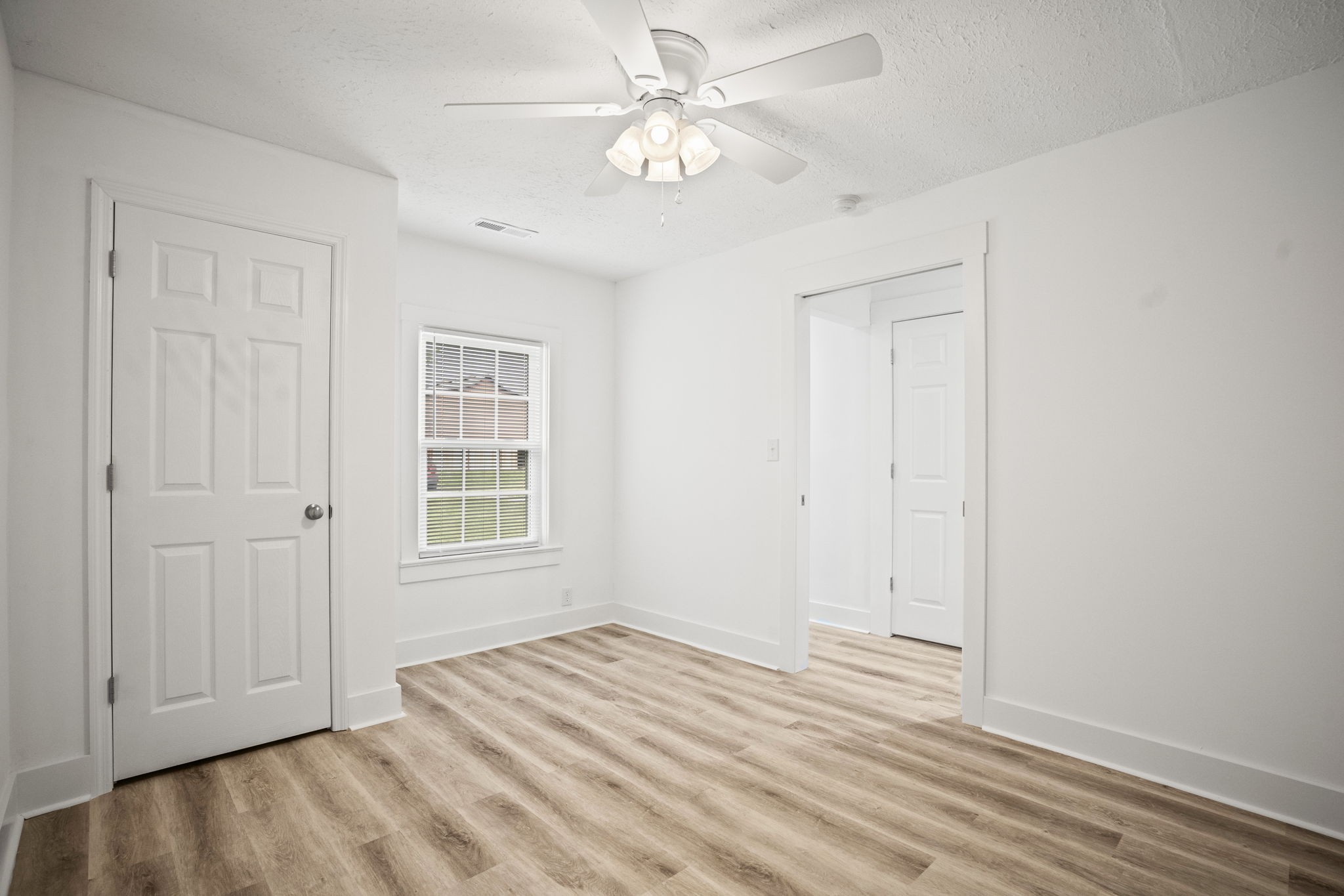7230 Highway 49 E Springfield Tn 37172 East Springfield, TN 37172 - Photo 22 of 33 a view of empty room with window and ceiling fan
