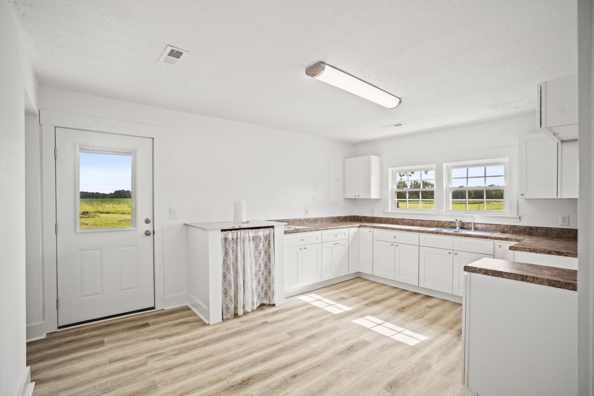 7230 Highway 49 E Springfield Tn 37172 East Springfield, TN 37172 - Photo 3 of 33 a kitchen with stainless steel appliances granite countertop a sink and cabinets