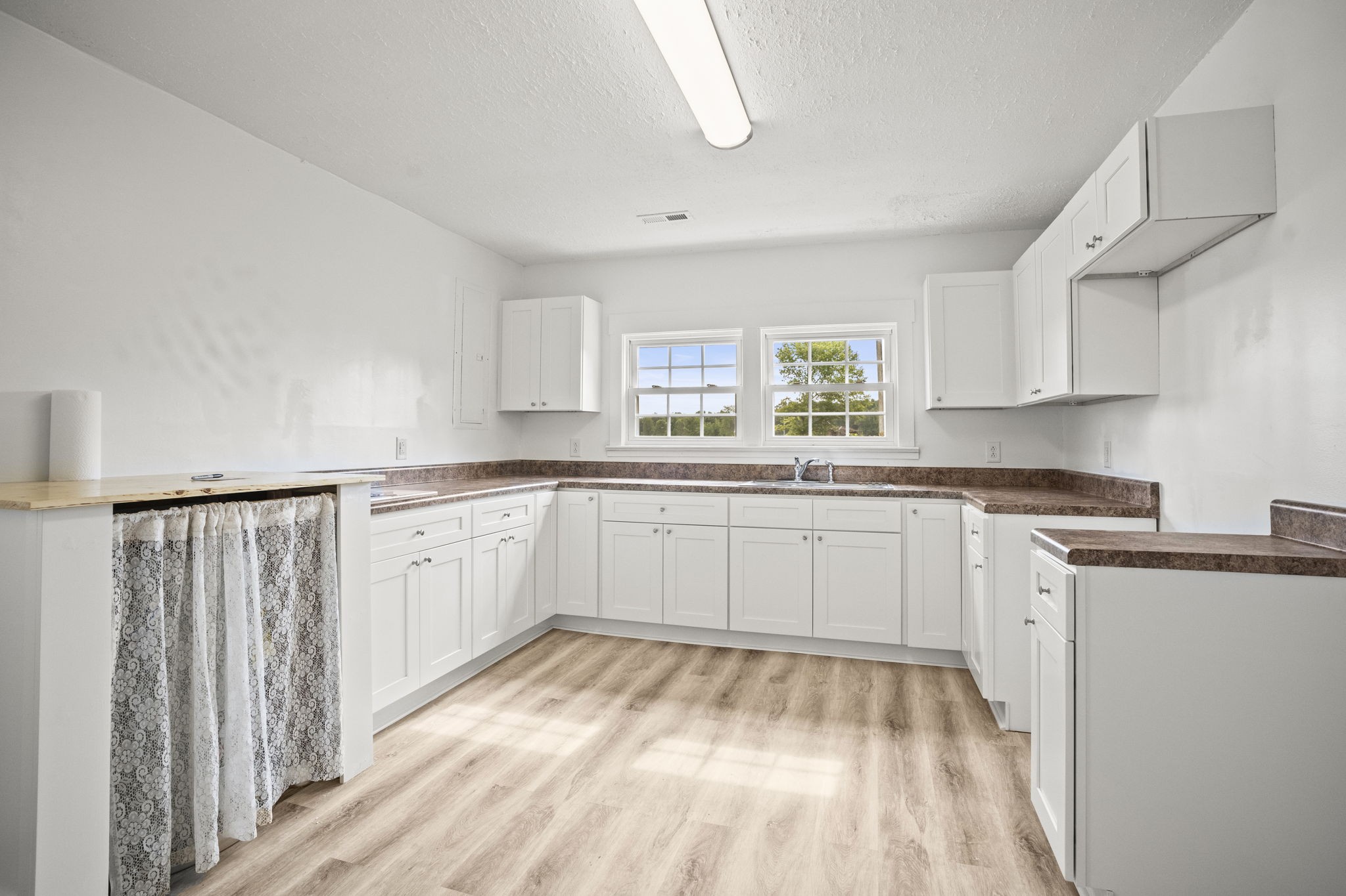 7230 Highway 49 E Springfield Tn 37172 East Springfield, TN 37172 - Photo 4 of 33 a kitchen with granite countertop white cabinets white appliances a sink and a window