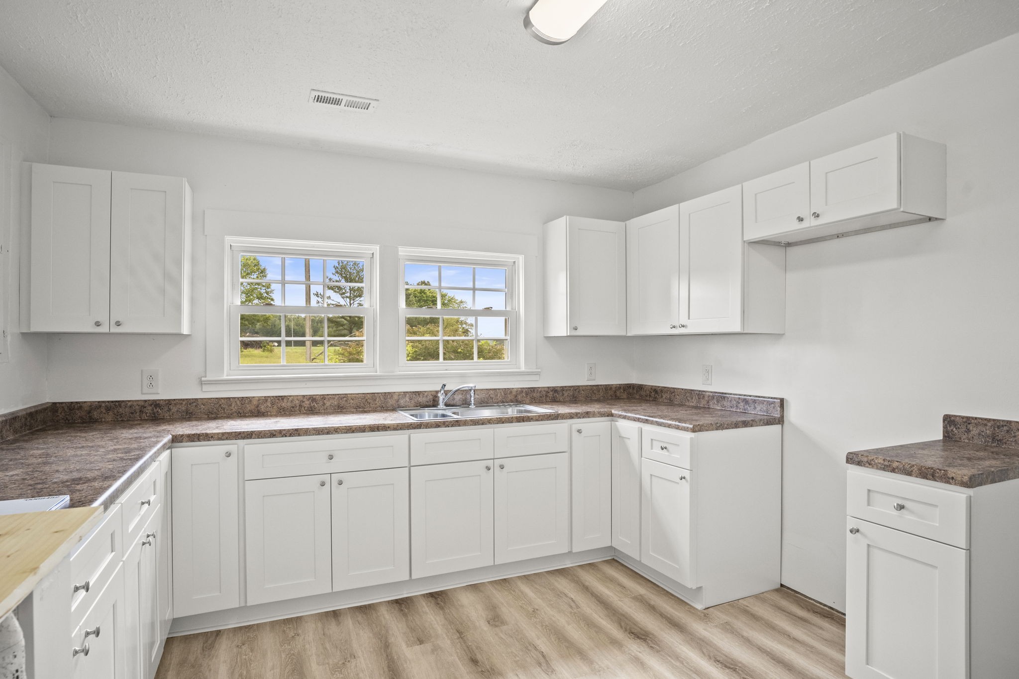 7230 Highway 49 E Springfield Tn 37172 East Springfield, TN 37172 - Photo 6 of 33 a kitchen with a sink stove and cabinets