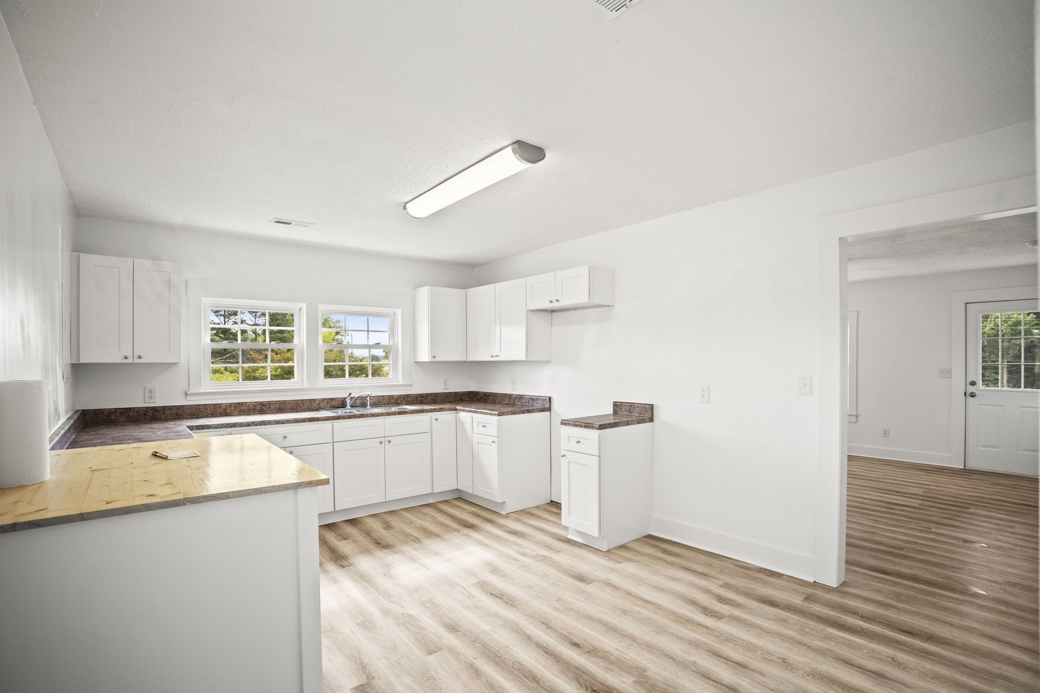 7230 Highway 49 E Springfield Tn 37172 East Springfield, TN 37172 - Photo 7 of 33 a kitchen with granite countertop a sink cabinets and wooden floor