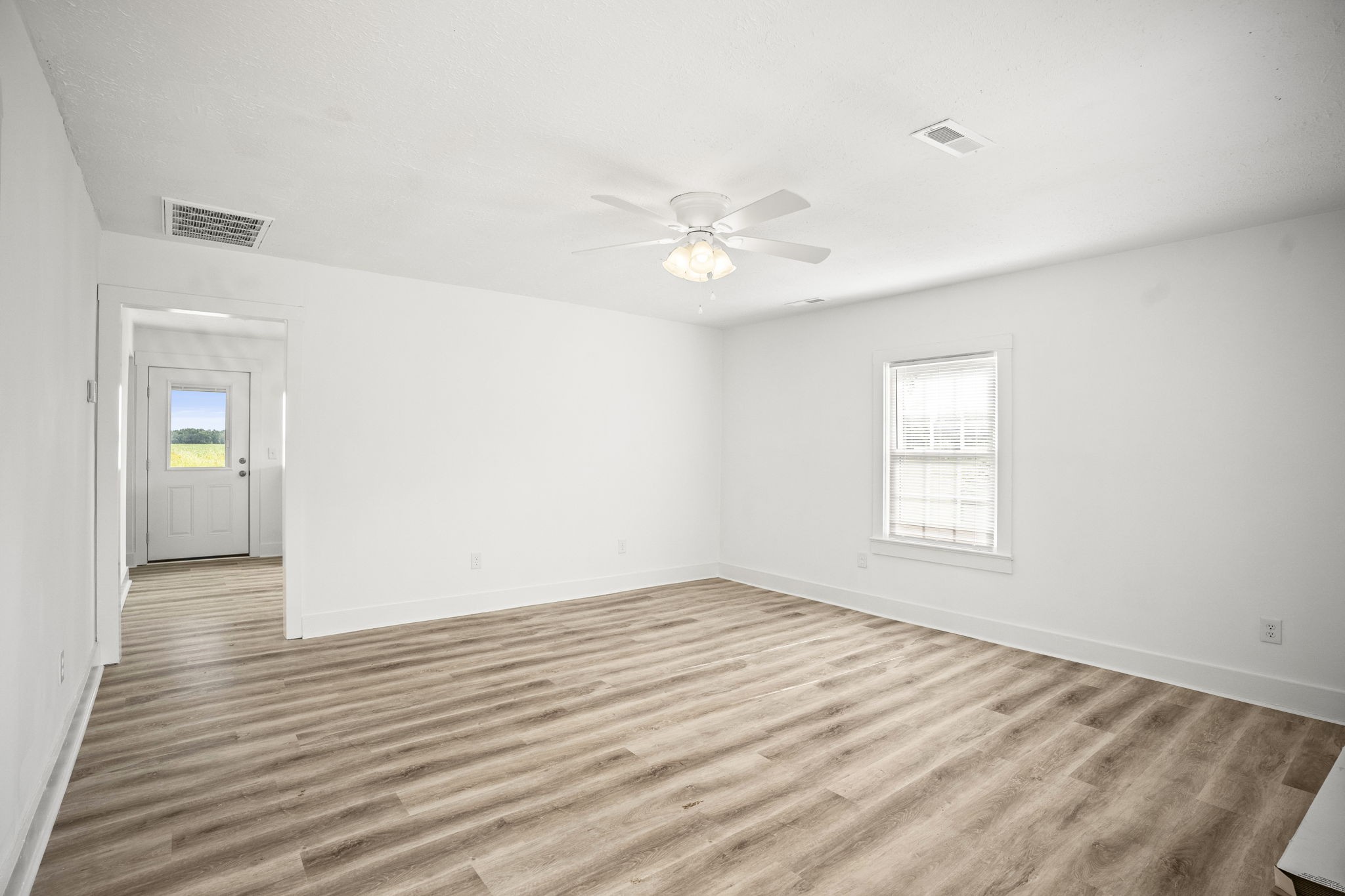 7230 Highway 49 E Springfield Tn 37172 East Springfield, TN 37172 - Photo 9 of 33 wooden floor in an empty room with a window