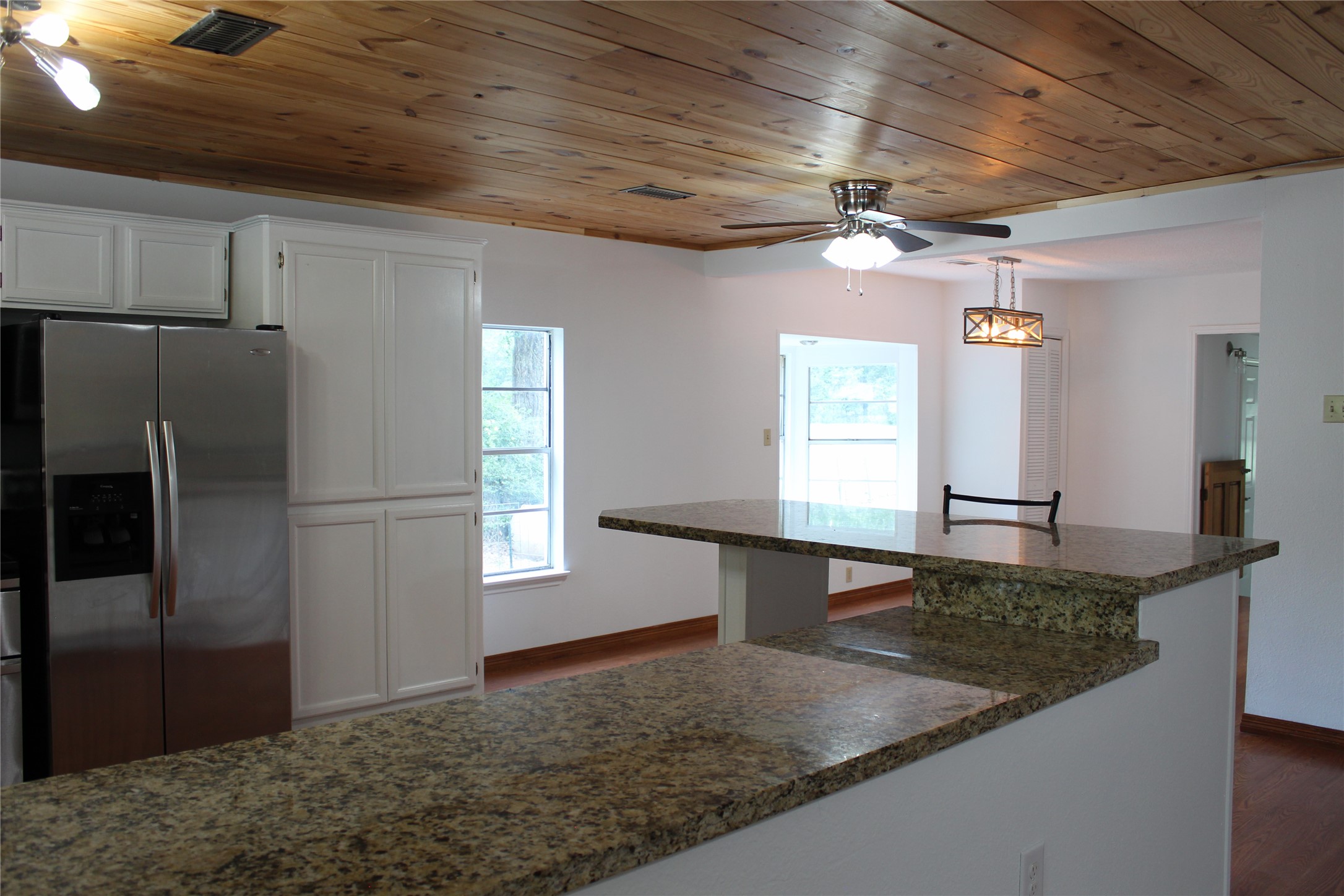 14040 FM 1484 Road Conroe, TX 77303 - Photo 13 of 47 a view of a refrigerator and window in a room