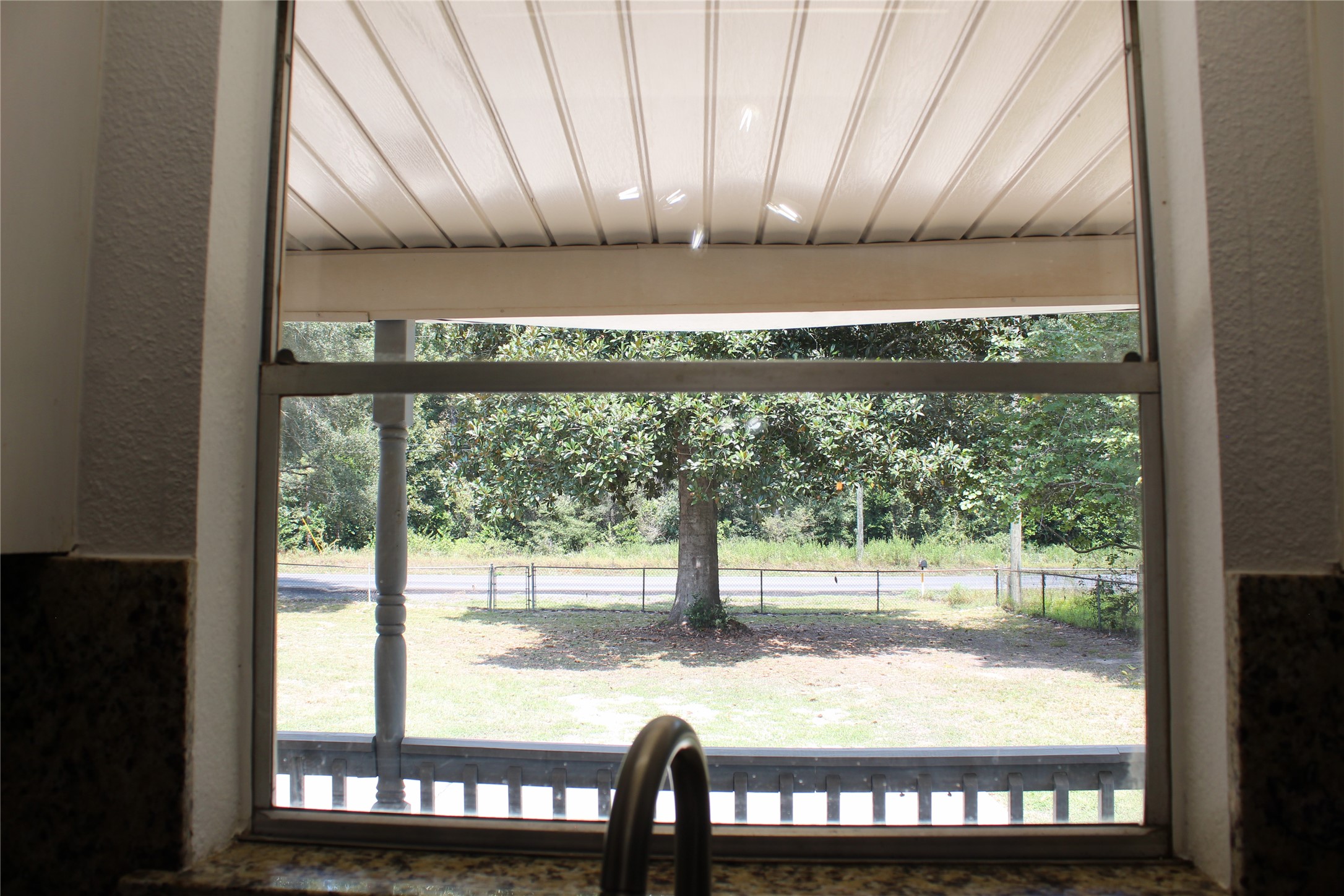 14040 FM 1484 Road Conroe, TX 77303 - Photo 14 of 47 a front view of a house with a porch