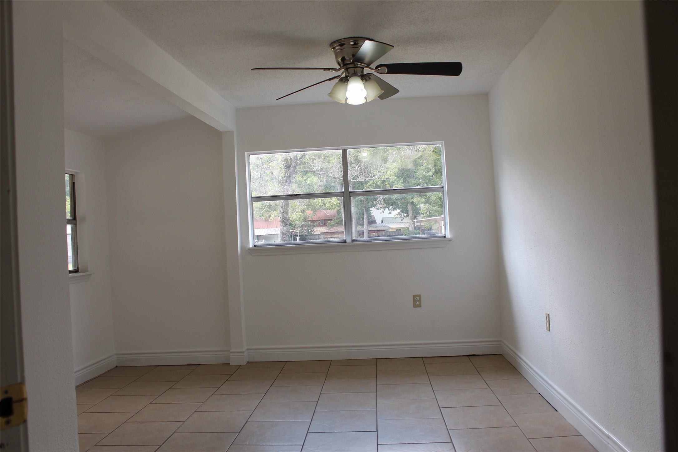 14040 FM 1484 Road Conroe, TX 77303 - Photo 23 of 47 a view of an empty room with a window