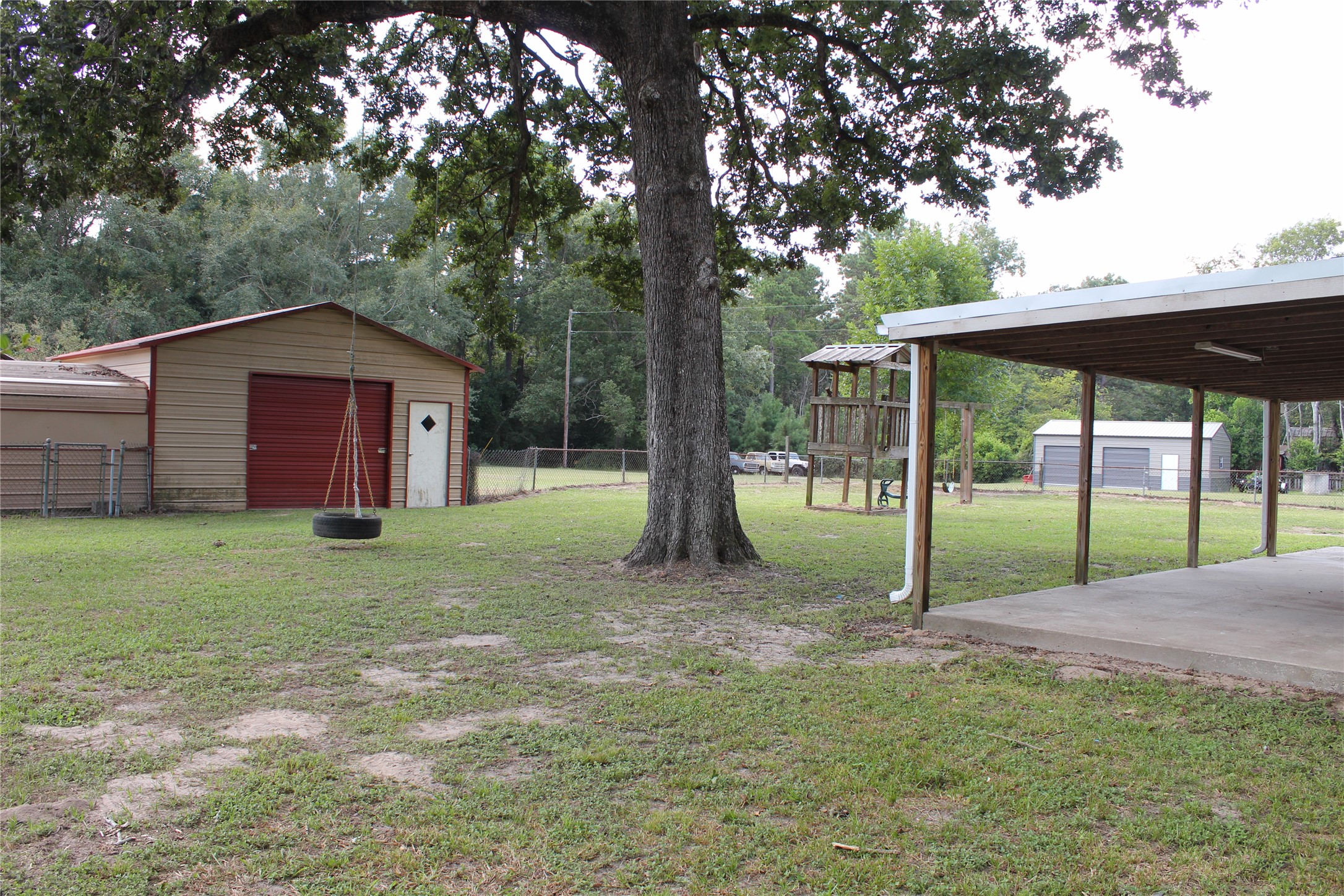 14040 FM 1484 Road Conroe, TX 77303 - Photo 29 of 47 a view of a house with backyard and garden