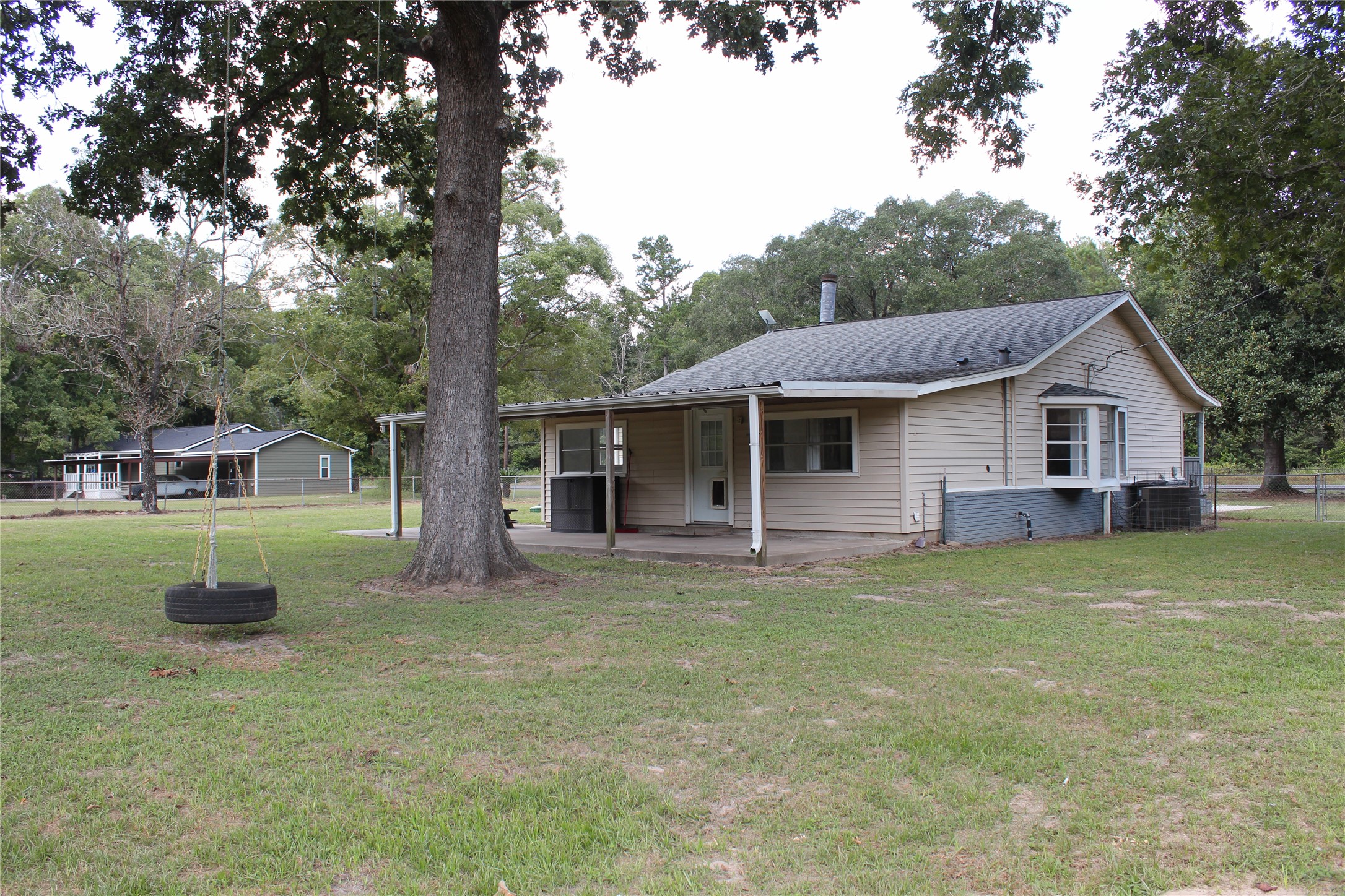 14040 FM 1484 Road Conroe, TX 77303 - Photo 30 of 47 a front view of a house with a garden