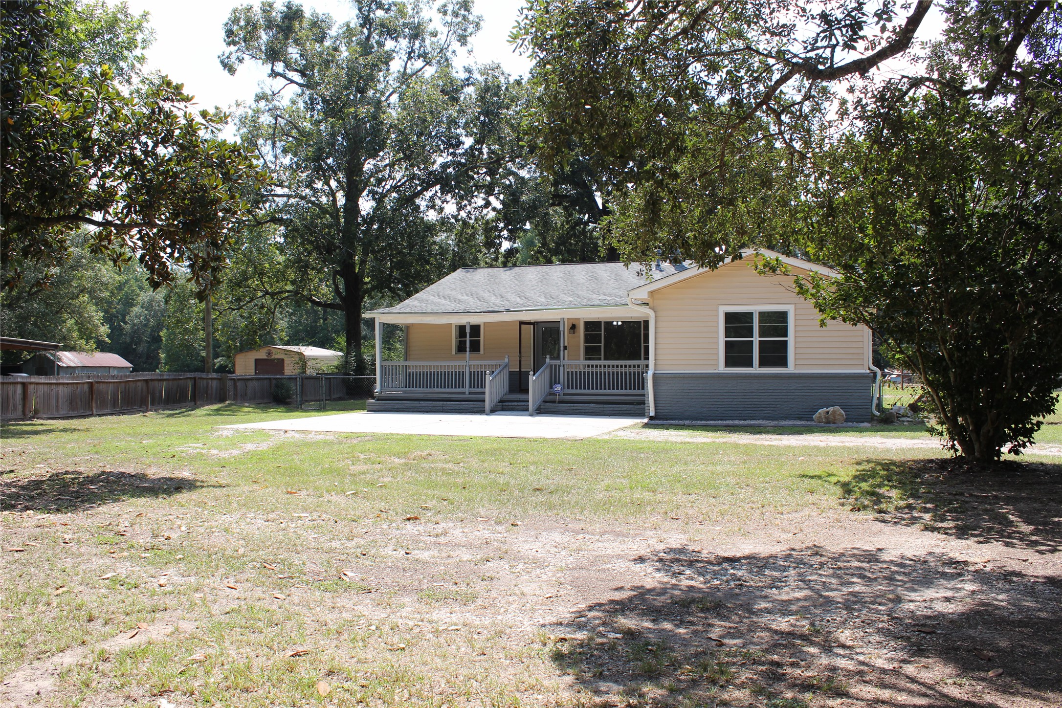 14040 FM 1484 Road Conroe, TX 77303 - Photo 3 of 47 a front view of a house with a yard