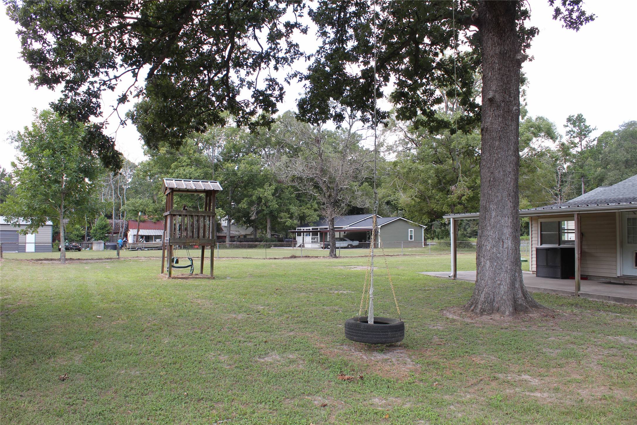 14040 FM 1484 Road Conroe, TX 77303 - Photo 31 of 47 a view of a house with a backyard